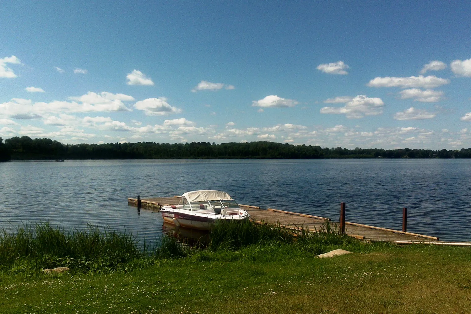 A boat tied up at a dock on Lake Saint-Louis, Beaconsfield