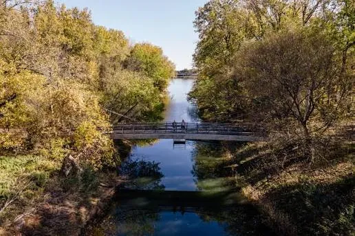 A footbridge over a tree-lined channel in the Parc national des Îles-de-Boucherville