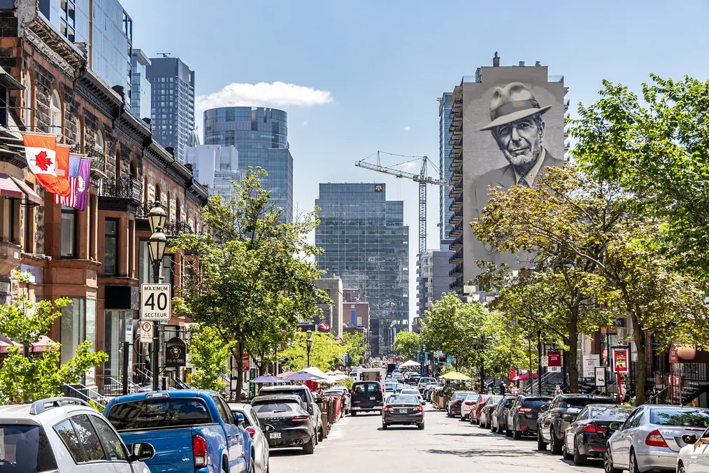 Crescent Street downtown, with the Leonard Cohen mural above the rooftops