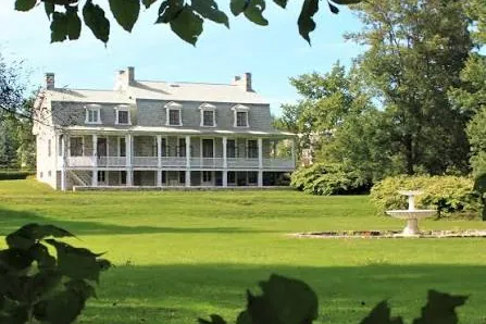 The Maison Garth and its gallery, seen across the lawn at the Domaine Garth in Lorraine