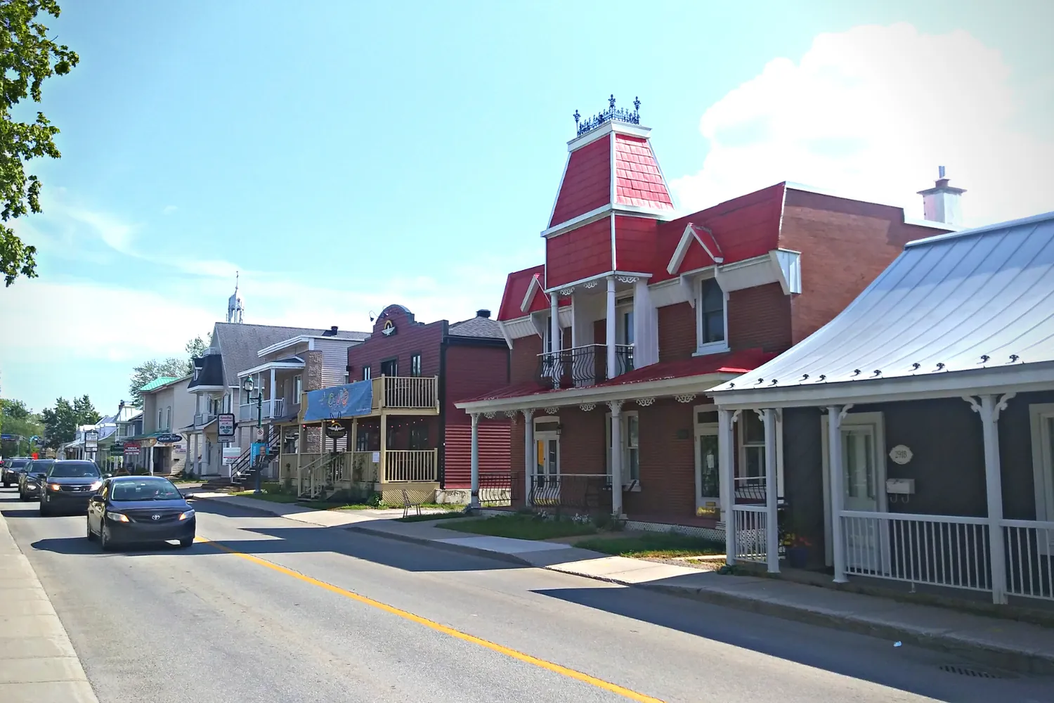 Old houses and shopfronts along the main street of the old village in Mascouche