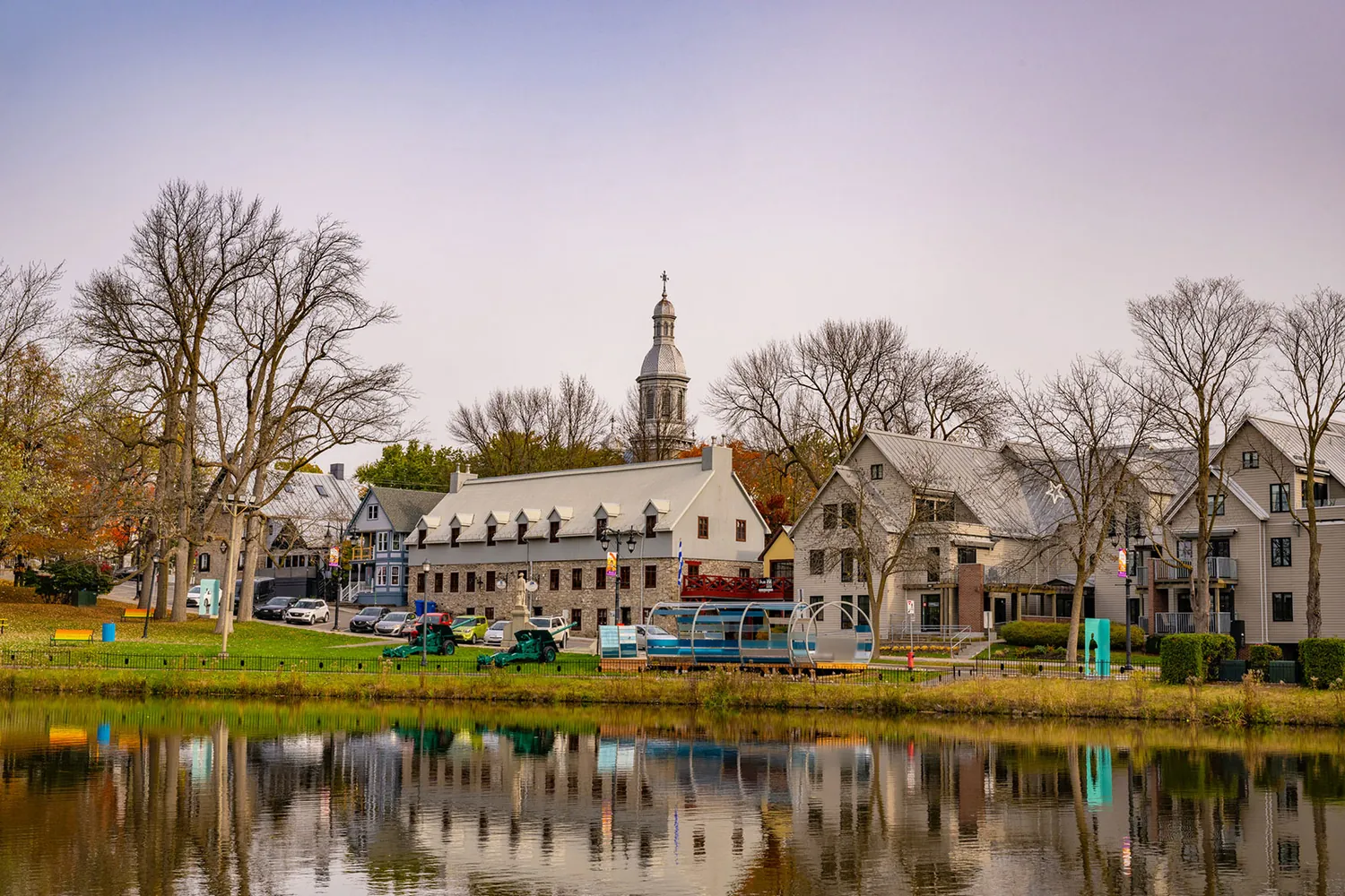Vieux-Terrebonne and its church steeple reflected in the water