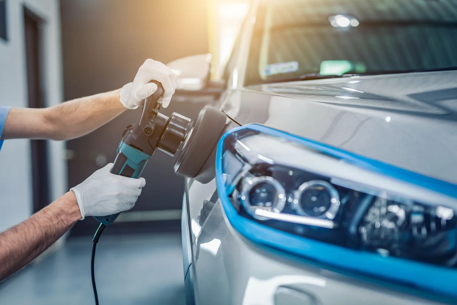 Machine polishing a headlight before ceramic coating